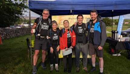 5 walkers preparing for the start of the Yorkshire 3 Peaks Challenge